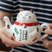 Japanese-style Maneki Neko Porcelain Tea Set with Strainer